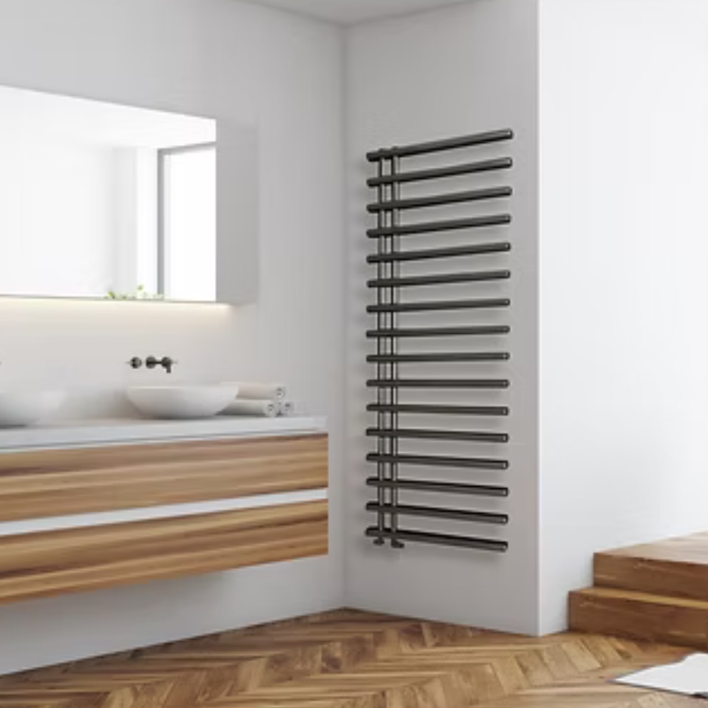 Lifestyle image of the Radox Linx 1550mm x 500mm Black Pearl Towel Radiator mounted on a white bathroom wall, aside a wall-mounted double vanity unit & basin